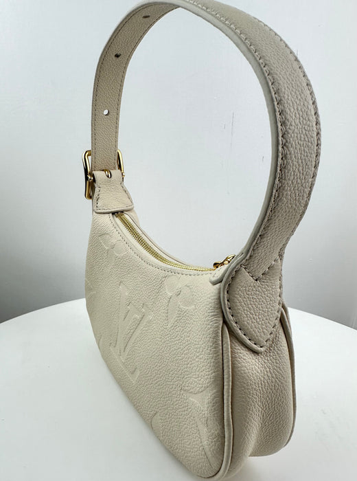 Louis Vuitton Mini Moon Monogram Empreinte Leather Creme