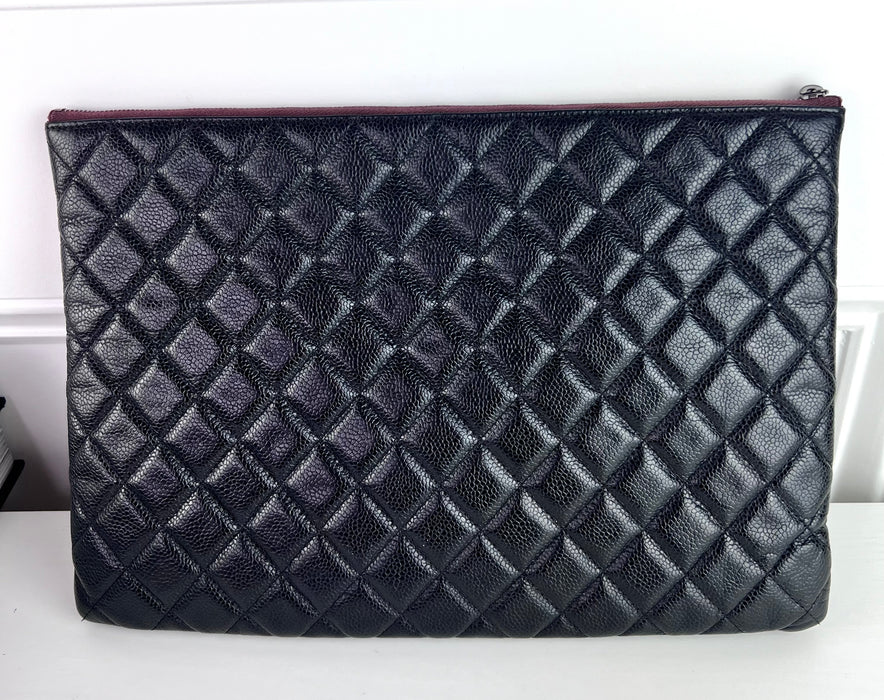 Chanel large O-Case Pouch Caviar Leather