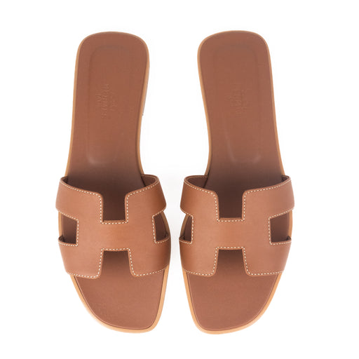 Hermes Oran Sandals in Gold Piqûres Écrues