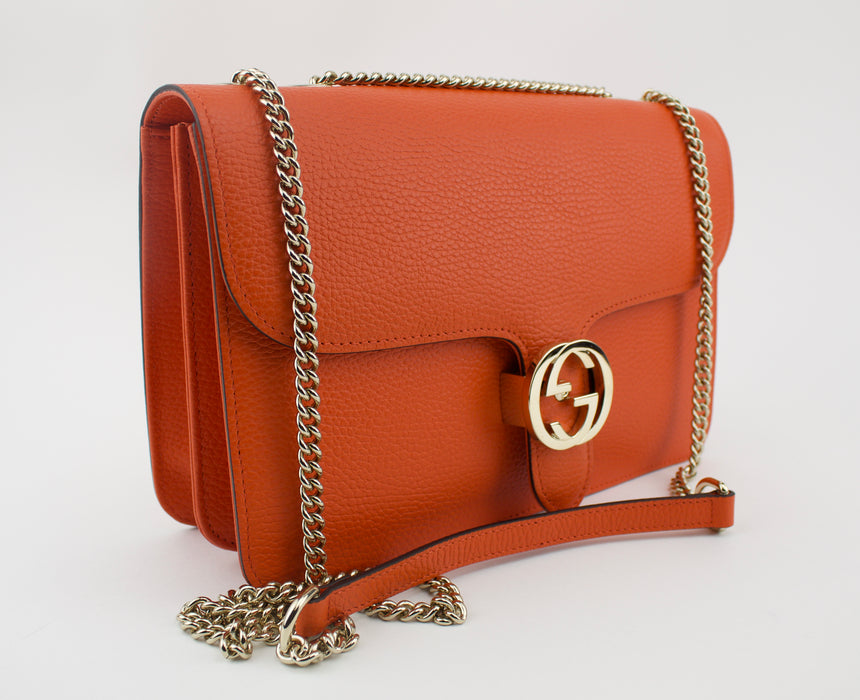 GUCCI MEDIUM INTERLOCKING G SHOULDER BAG ORANGE.