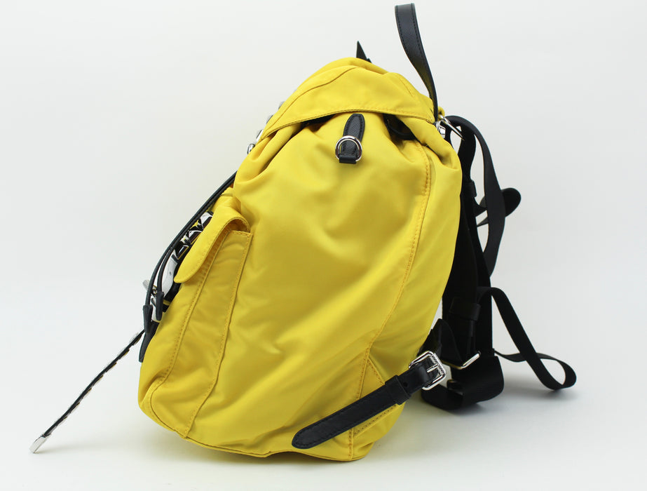 Prada yellow studded backpack