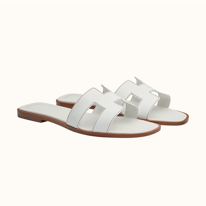 We guarantee this is an authentic Hermes Oran Sandals in white size 39.5 or full money back. This product is brand new with dust bag and box.     Reference Number: H021056Z 02340     Luxurysnob is not affiliated with Hermes. We guarantee this is an authentic Hermes item or 100% of your money back. Hermes is a registered trademark of Hermes. 