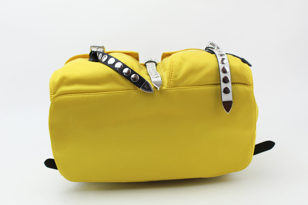 Prada yellow studded backpack