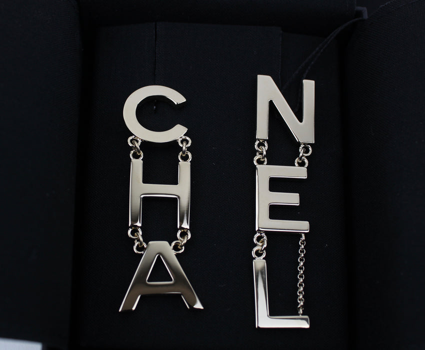 CHANEL METAL CHA-NEL LOGO DROP EARRINGS - LuxurySnob