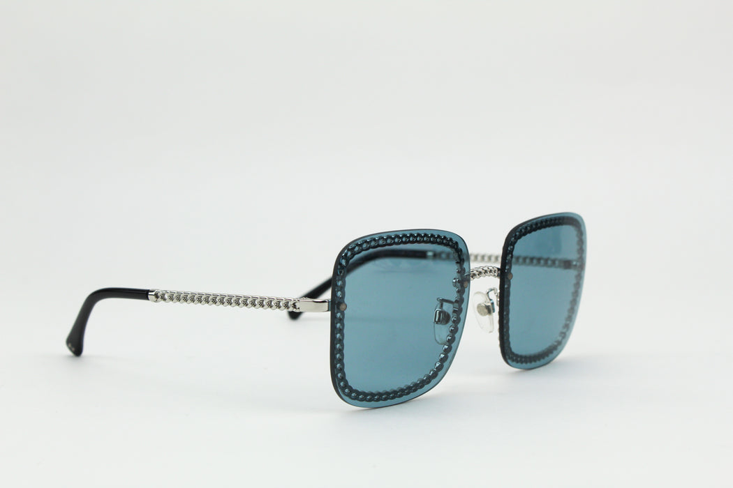 Chanel blue square chain around sunglasses