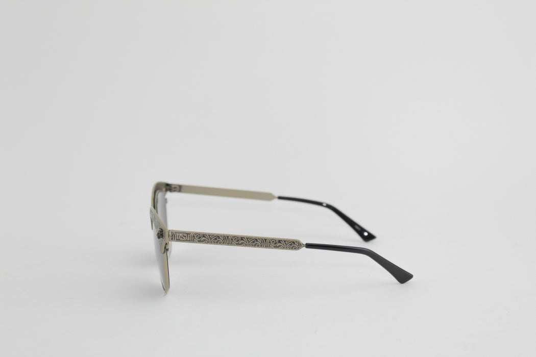 GUCCI BLACK AND GOLD SUNGLASSES
