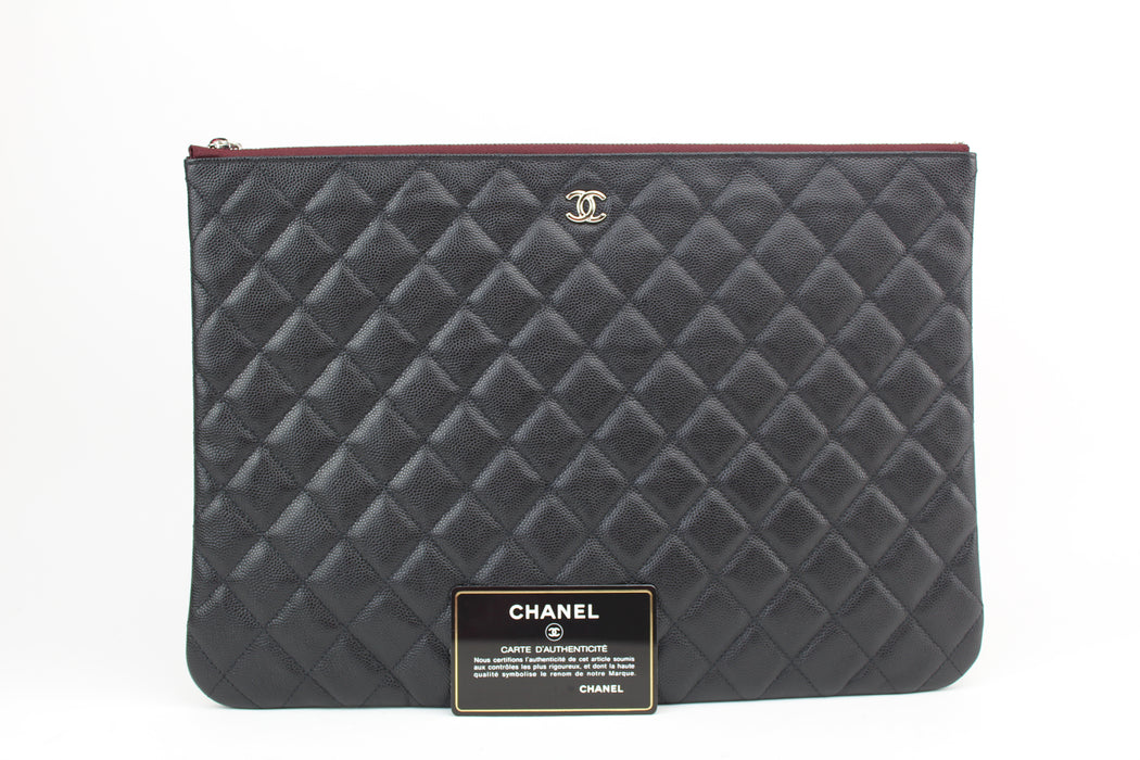 Chanel Large O Case Quilted Caviar Clutch